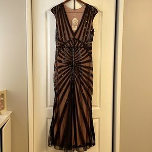 Sequined beaded gown. Petal rosed colored underneath. Side zip.